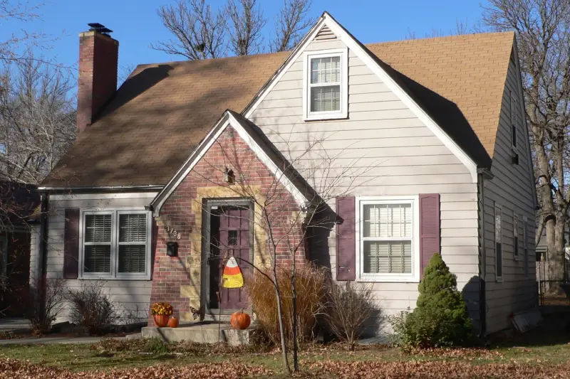 A Lincoln street of older homes with pitched shingle roofs